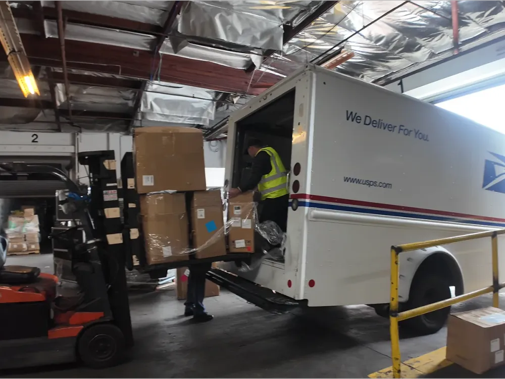 Handoff to a final-mile carrier at the U.S. warehouse
